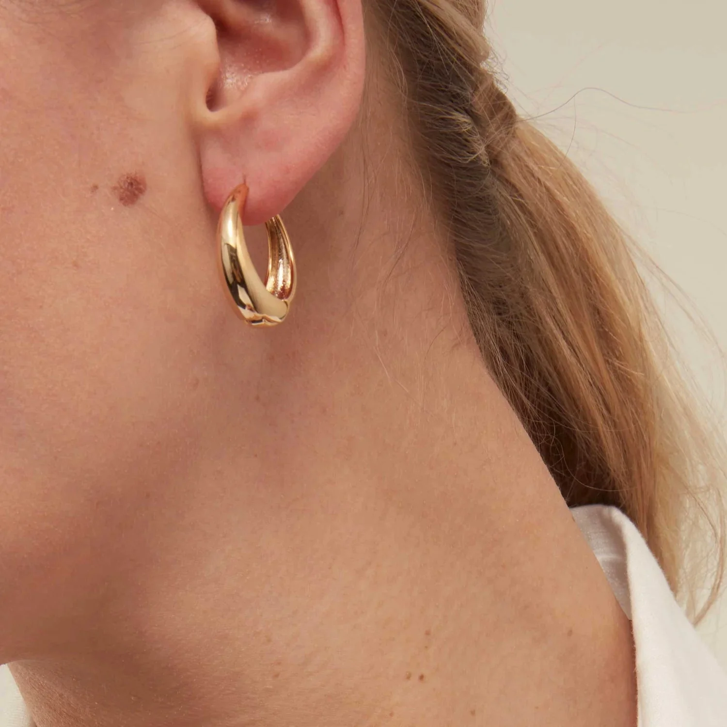 Large Tapered Hoop Earrings Pale Gold - Image 2